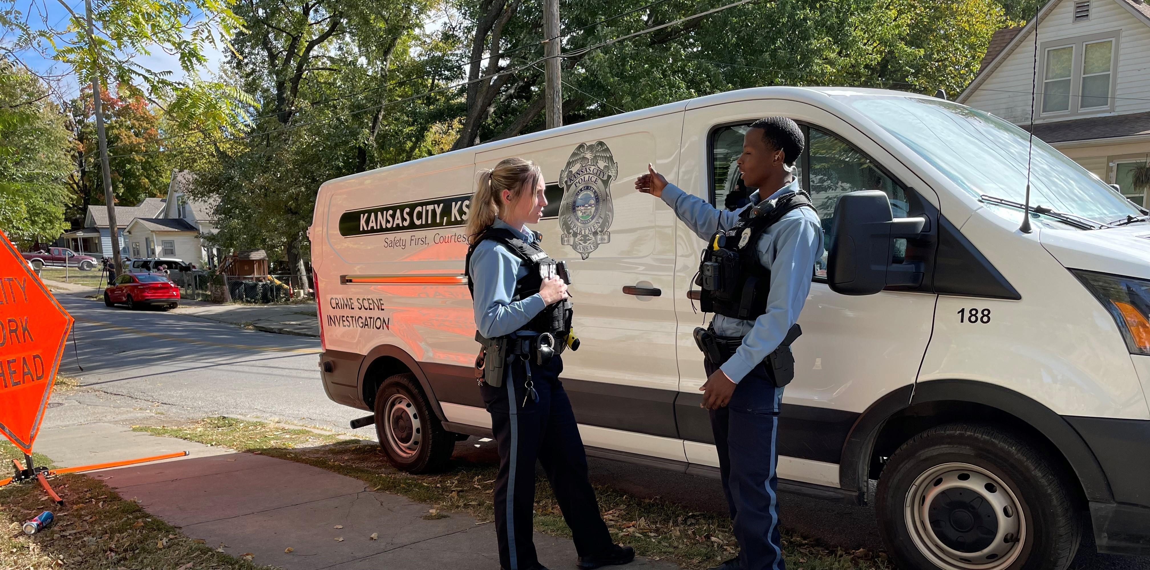 https://www.kckpd.org/files/sharedassets/police/v/2/images/slider-front-page/copy-of-crime-scene-officers-by-van.jpg